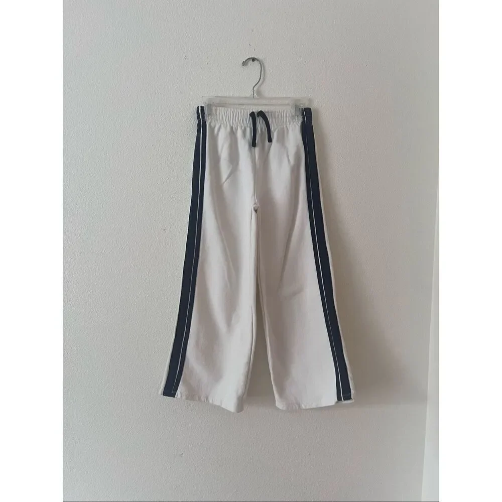 Zara Kids white wide-leg track pants with a black side stripe size 9